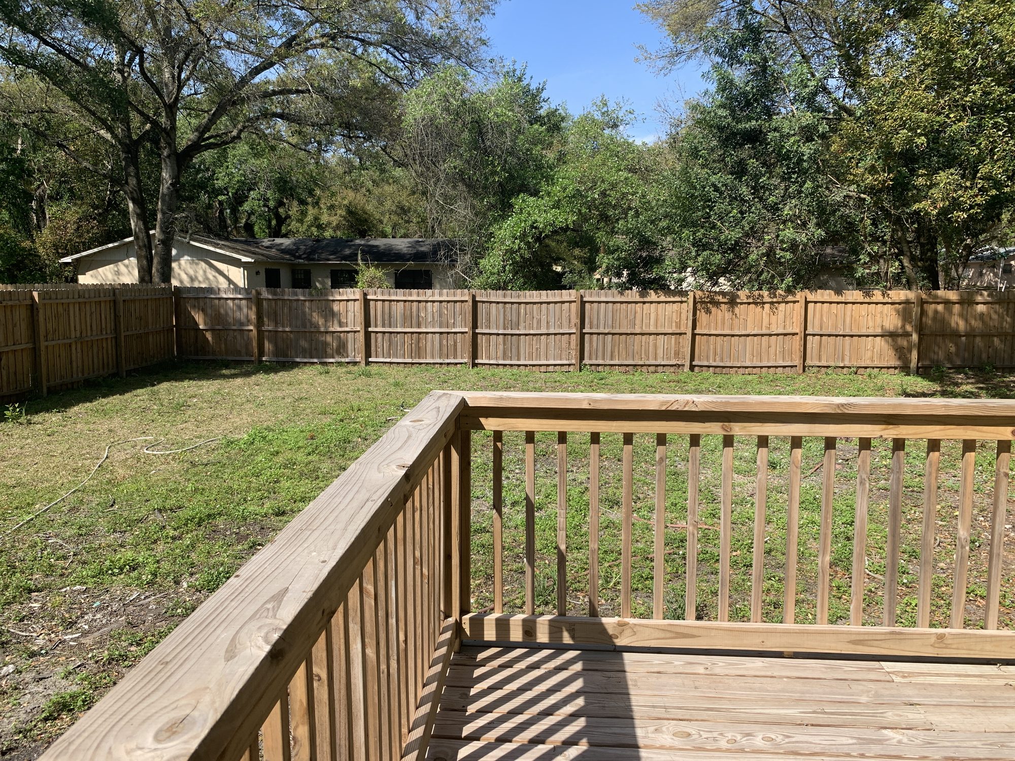New cedar deck and wood privacy fence combination — Blue Diamond Building, Jacksonville Beach FL