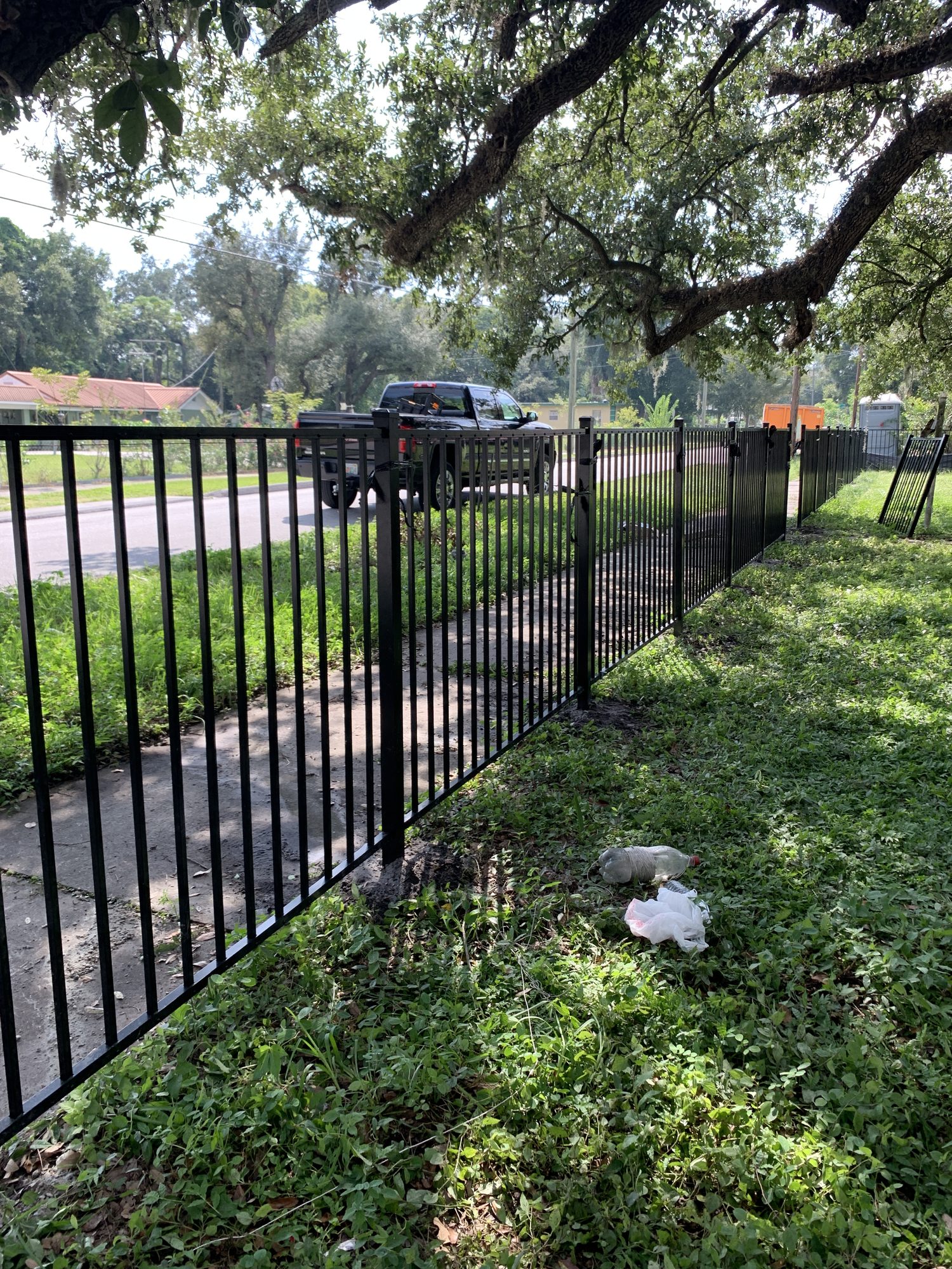 Black iron driveway gate installation — Blue Diamond Building, Jacksonville FL
